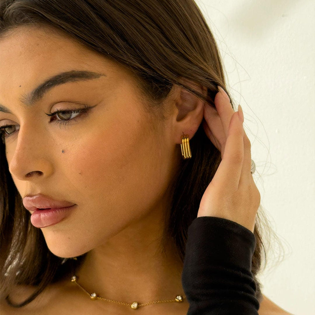Lustrous Curved Ribbed Gold Earrings