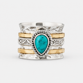 Antique Turquoise Inlaid Gold Silver Ring on a clean white studio background